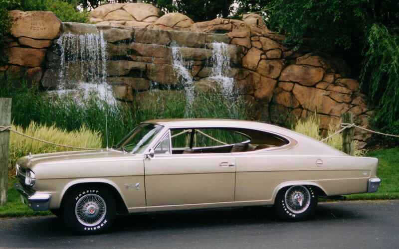 Classic car by waterfall