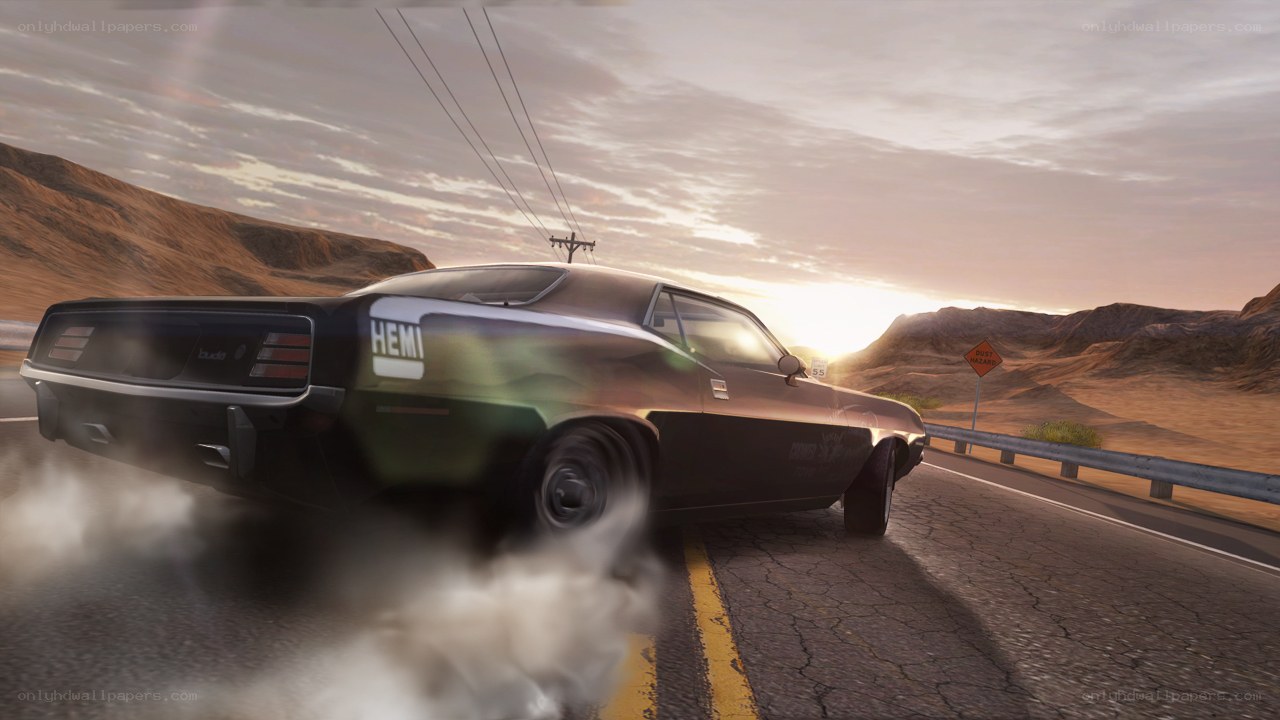 classic car drifting at sunset