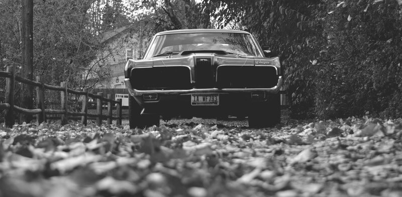 classic car in autumn leaves