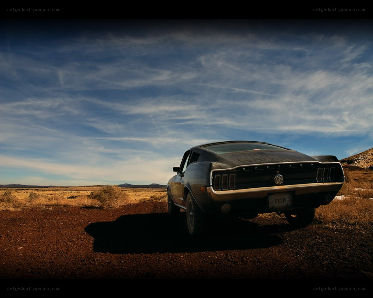 Classic car in desert landscape