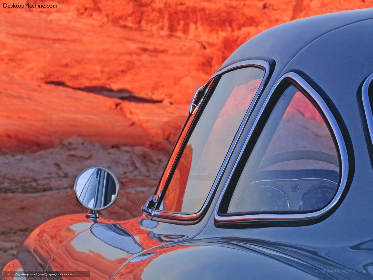 Classic car in desert sunset