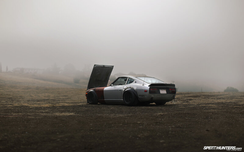 Classic car in foggy field