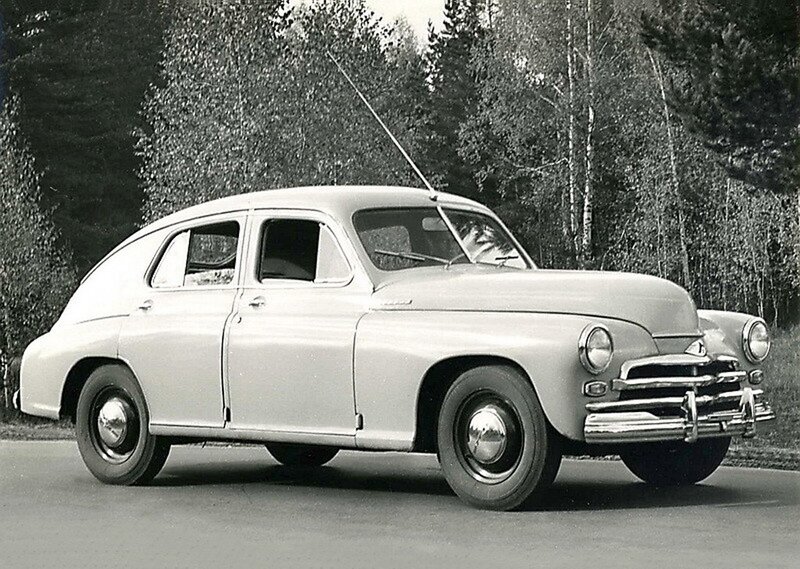Classic car in forest setting