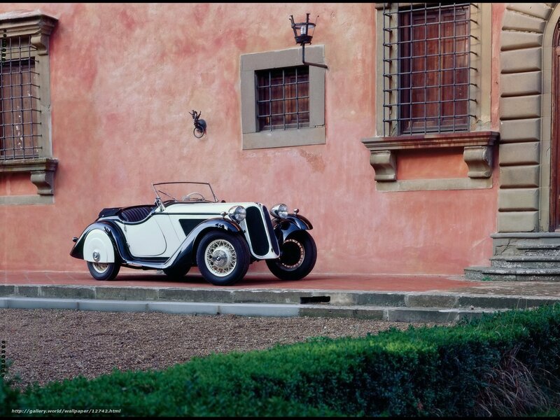 Classic car in front of a building