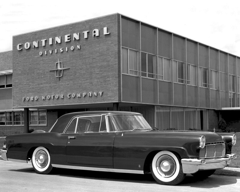 Classic car in front of building