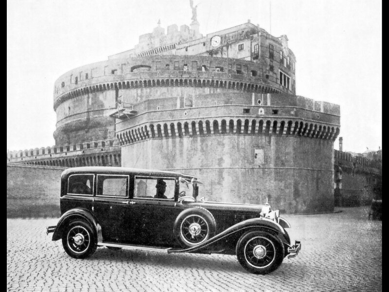 Classic car in front of castle