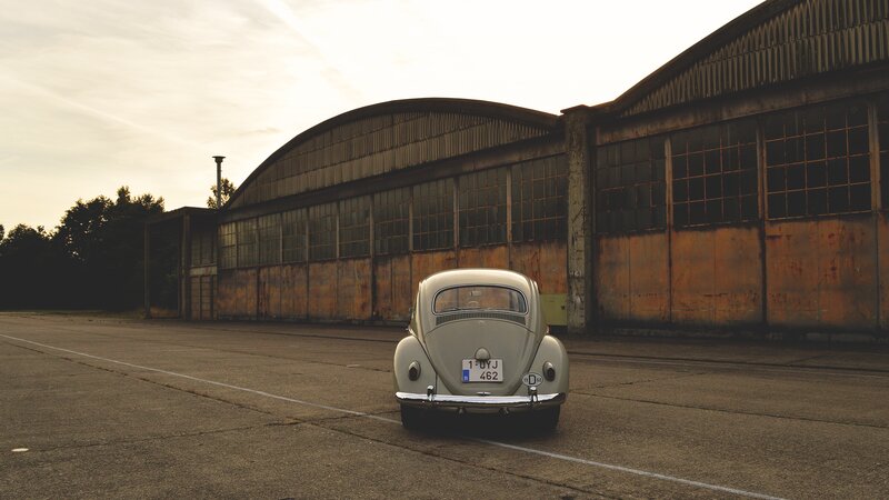Classic Car in Front of Hangar
