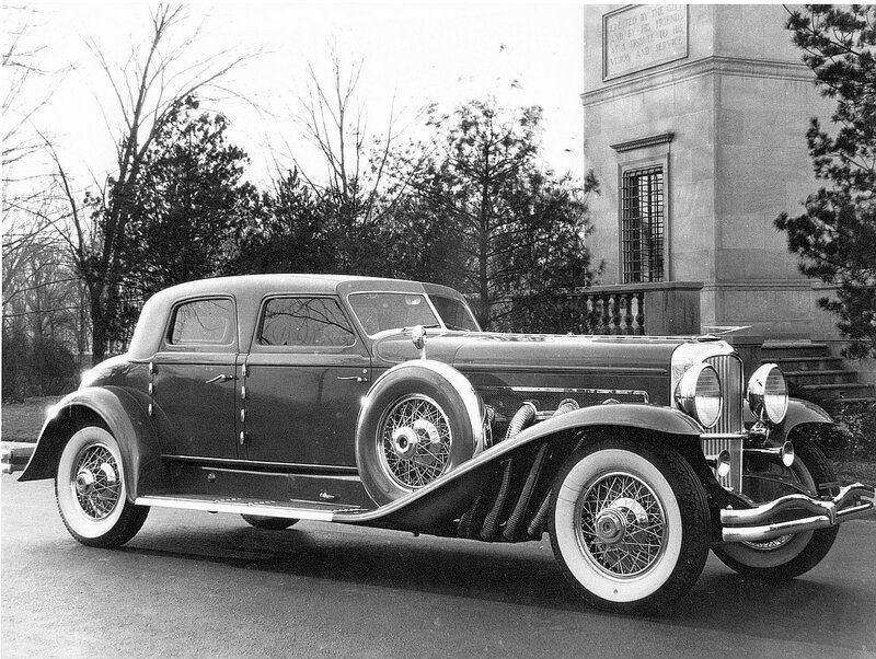 Classic car in front of monument