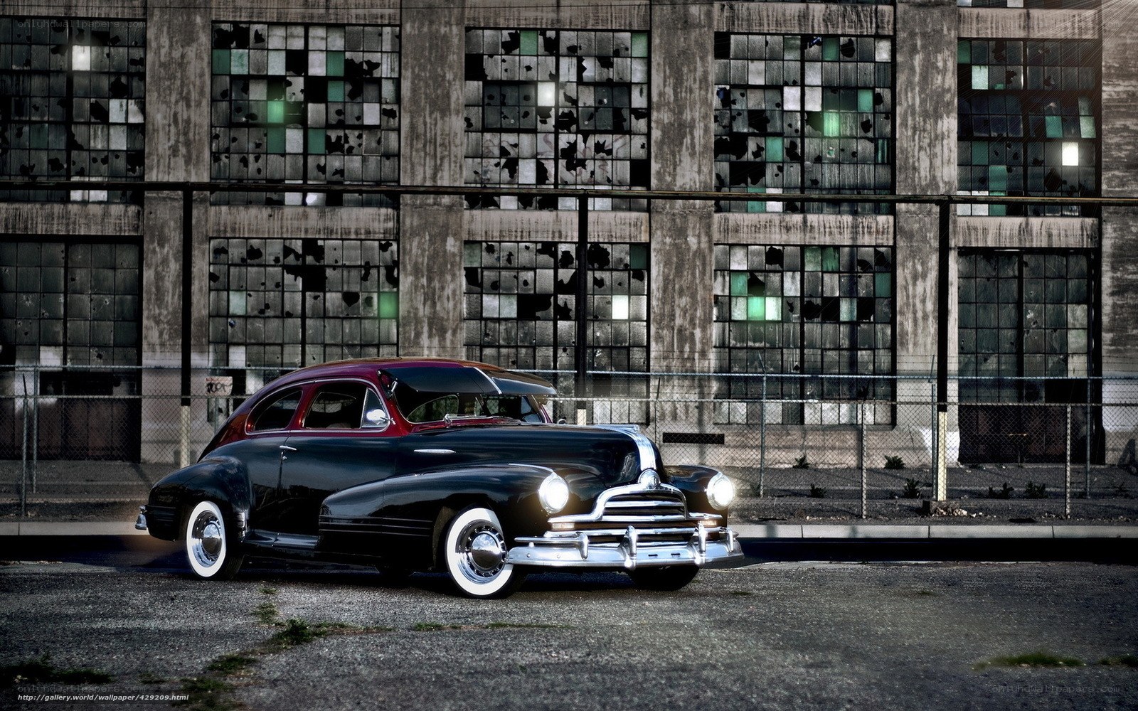 Classic car in front of old building