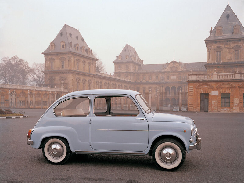 Classic car in front of palace