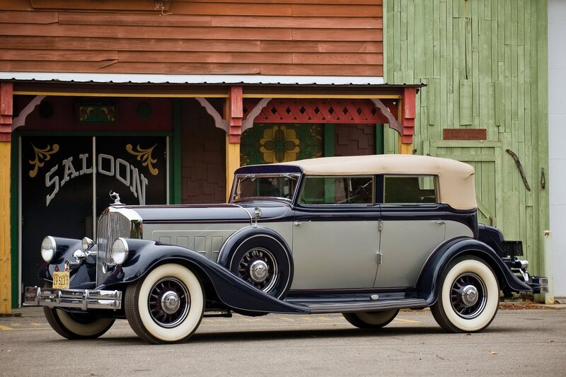 Classic car in front of saloon