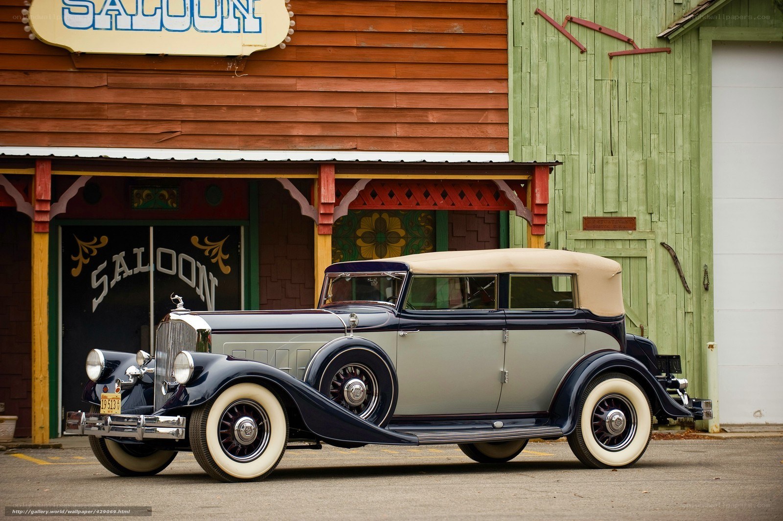 Classic car in front of saloon