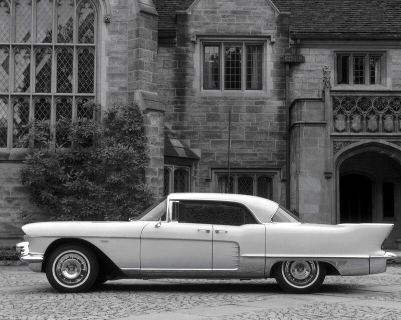 Classic car in front of stone building