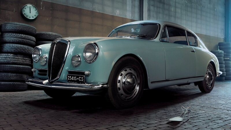 Classic car in garage with shoe