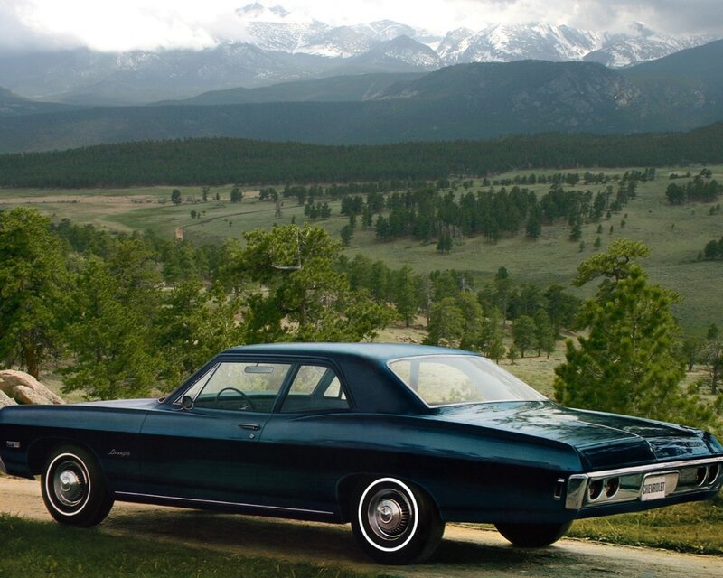 Classic car in mountain landscape