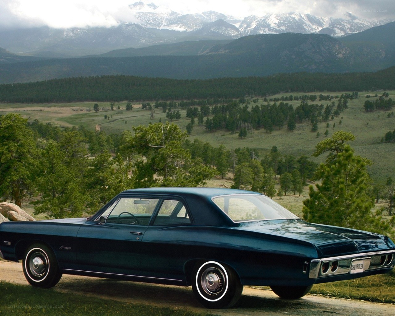Classic car in mountain landscape