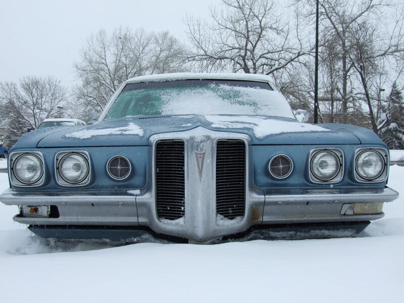 Classic car in snowy parking lot