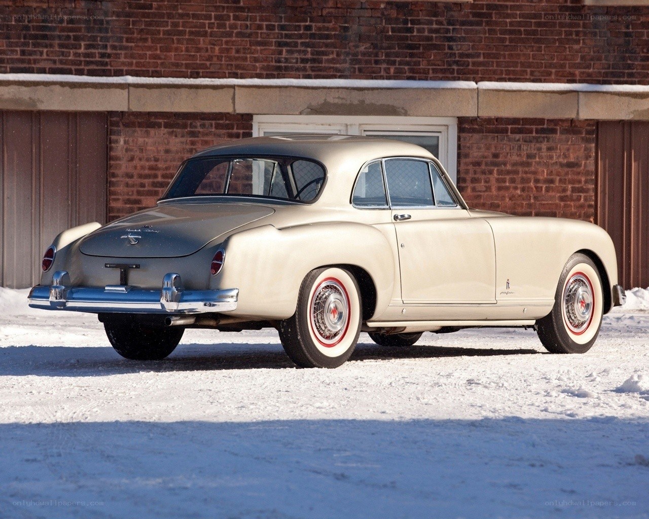 Classic car in snowy setting