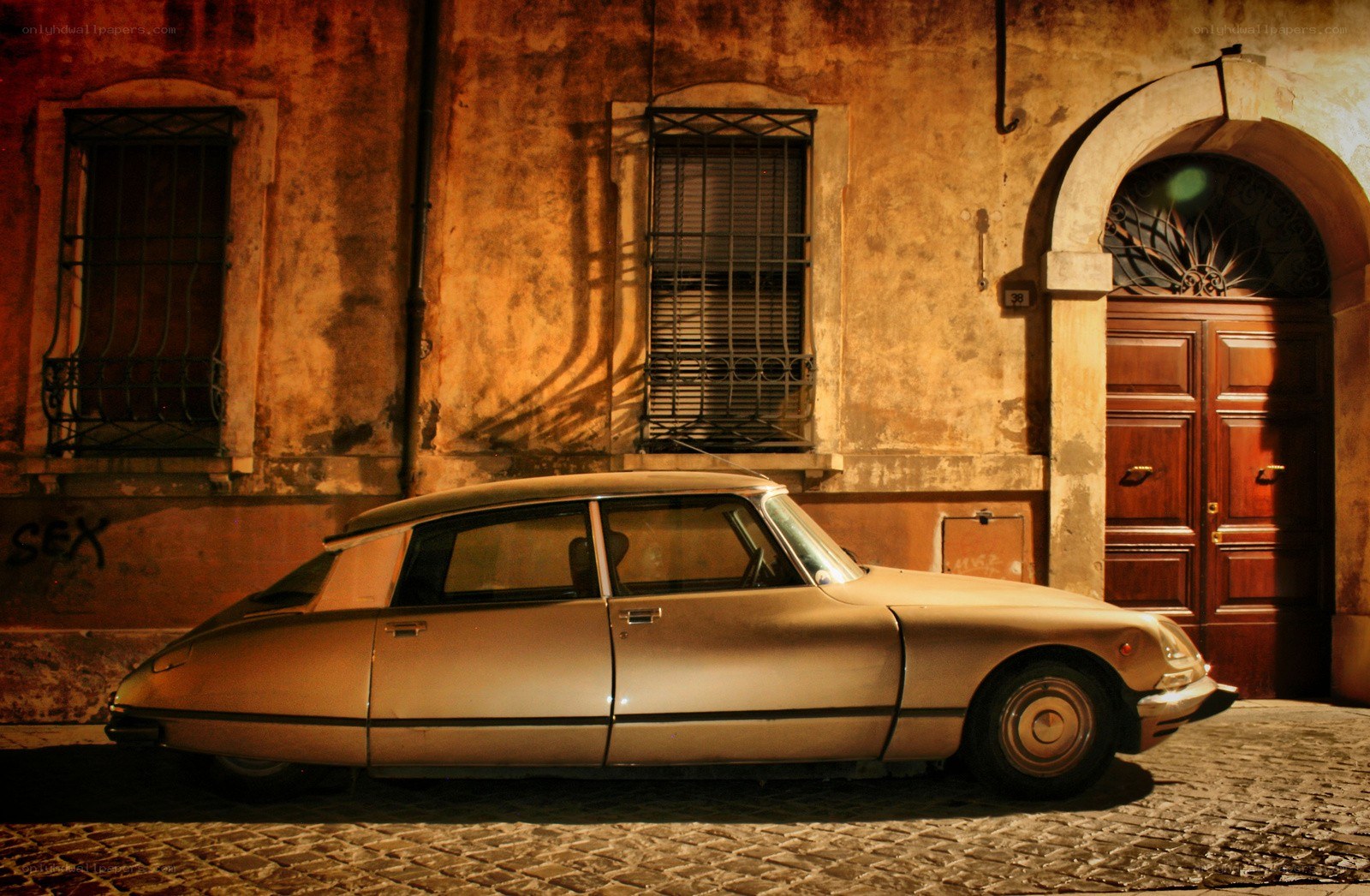 Classic car on a cobblestone street
