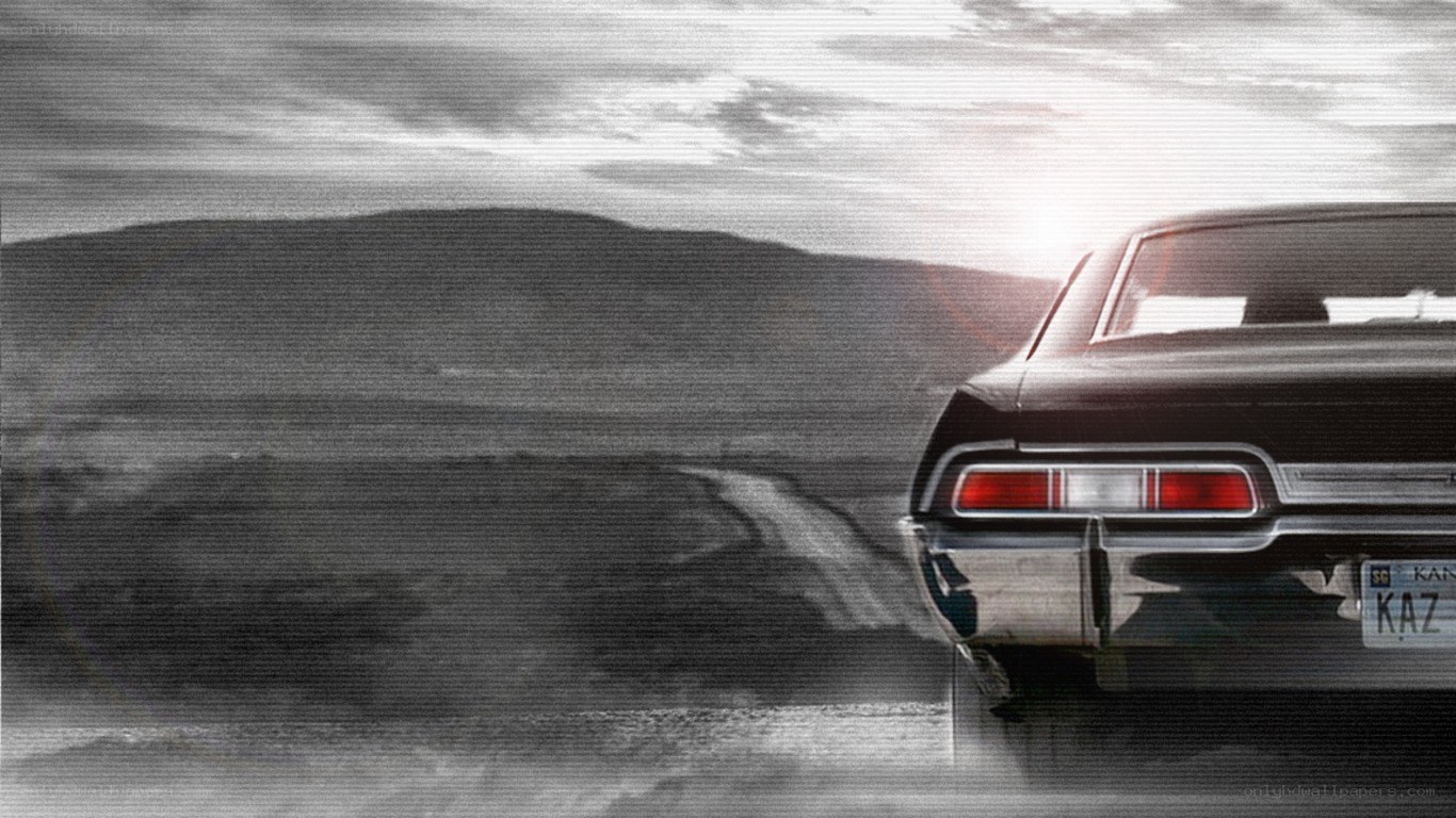 classic car on a desert road