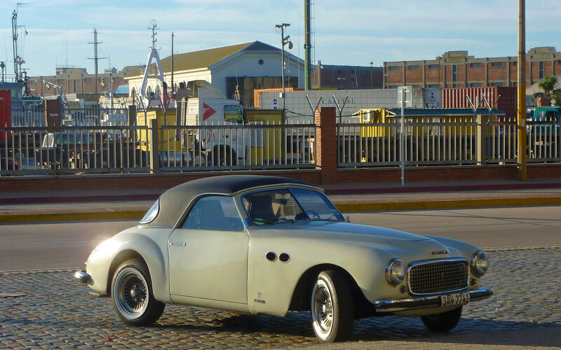 Classic car on cobblestone street