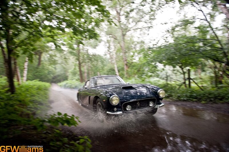 classic car on wet forest road