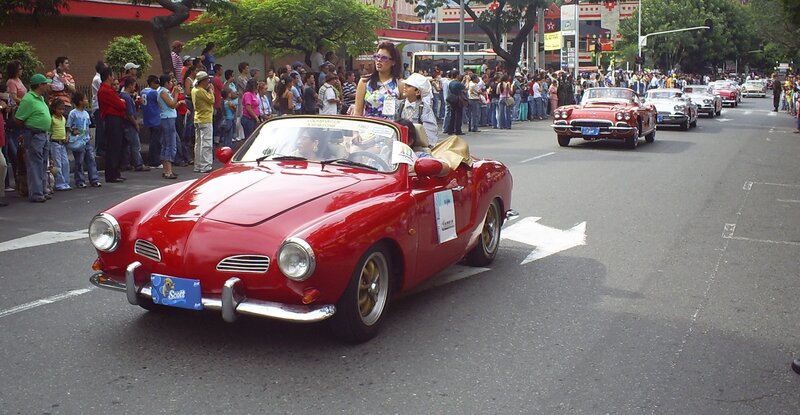 Classic car parade on city street