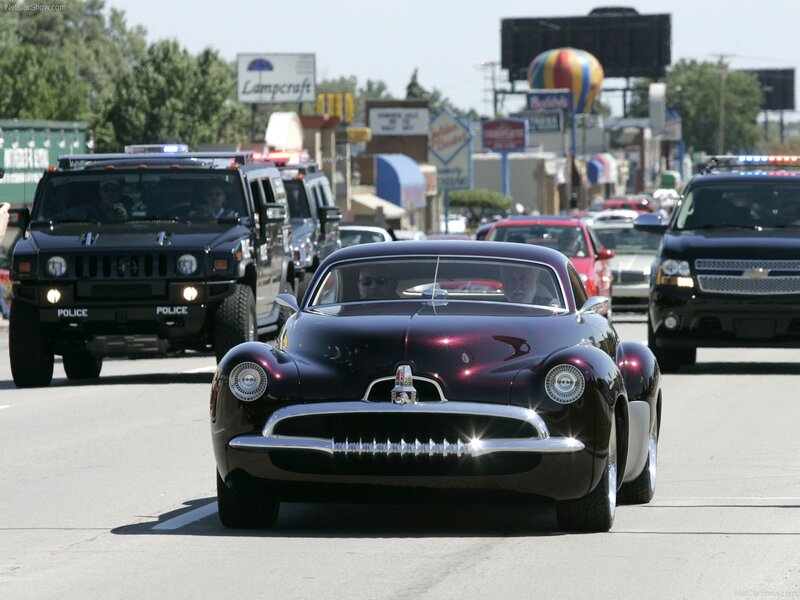 Classic car parade with police escort