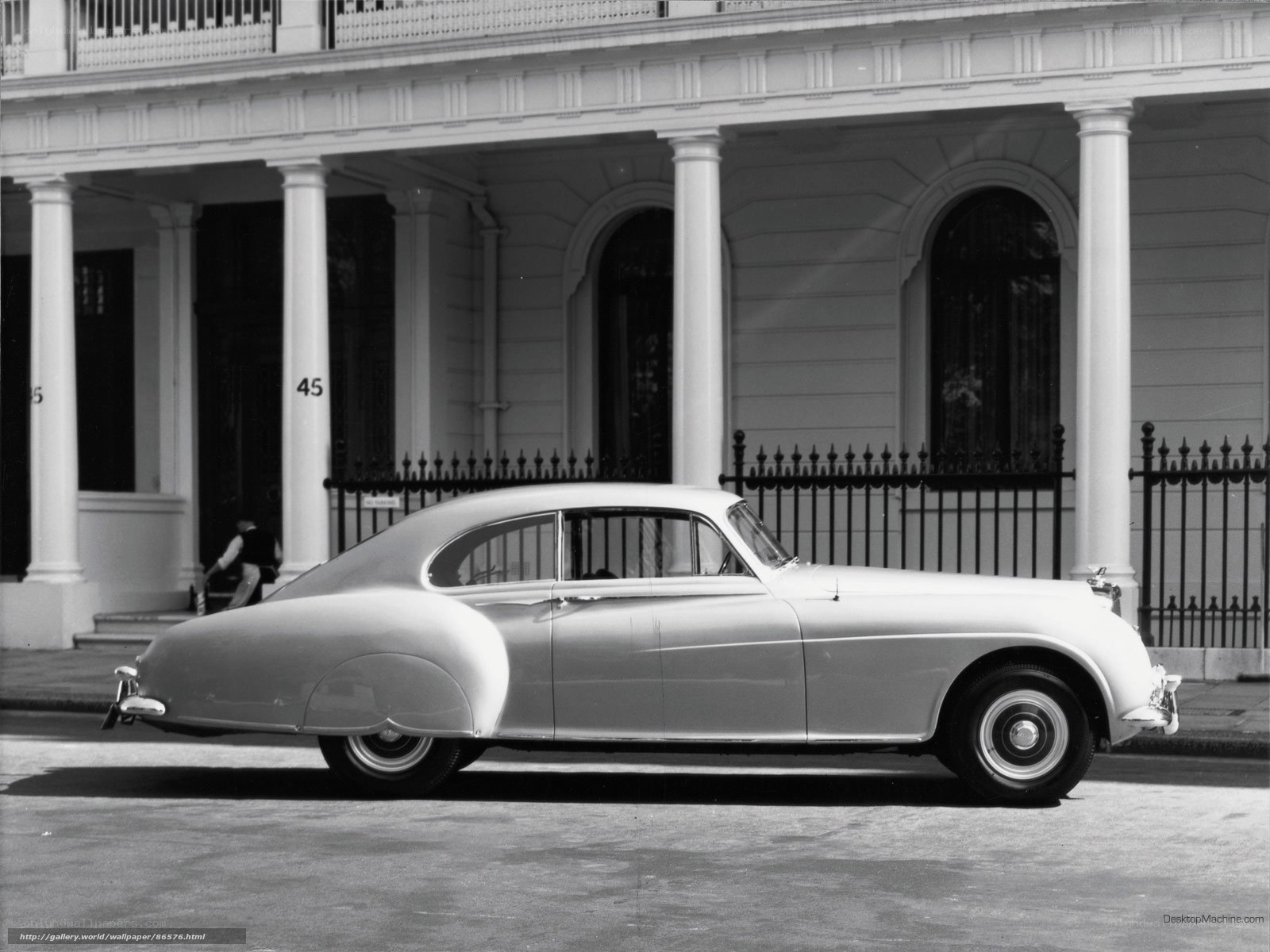 Classic car parked in front of building