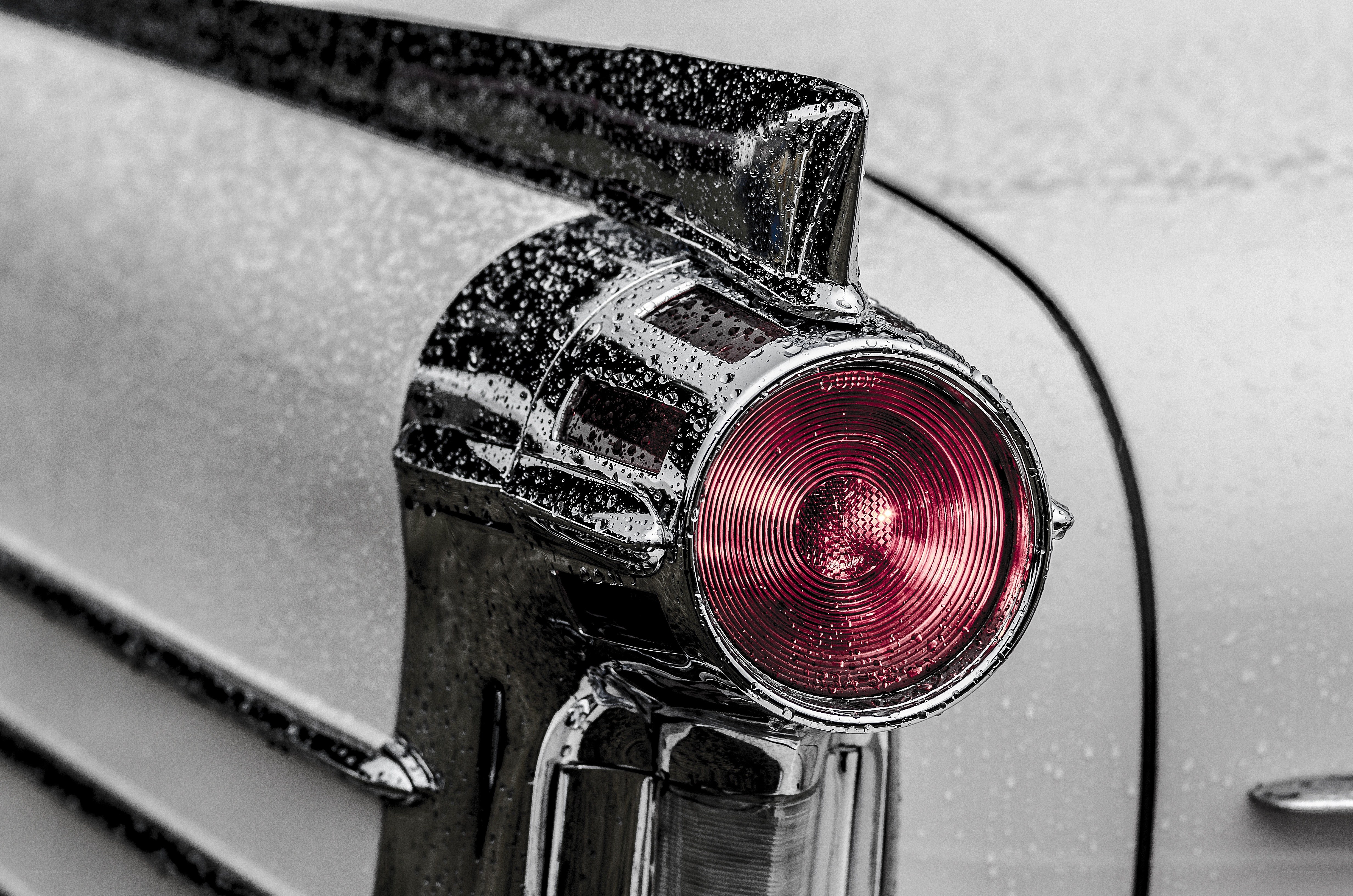Classic car tail light in rain