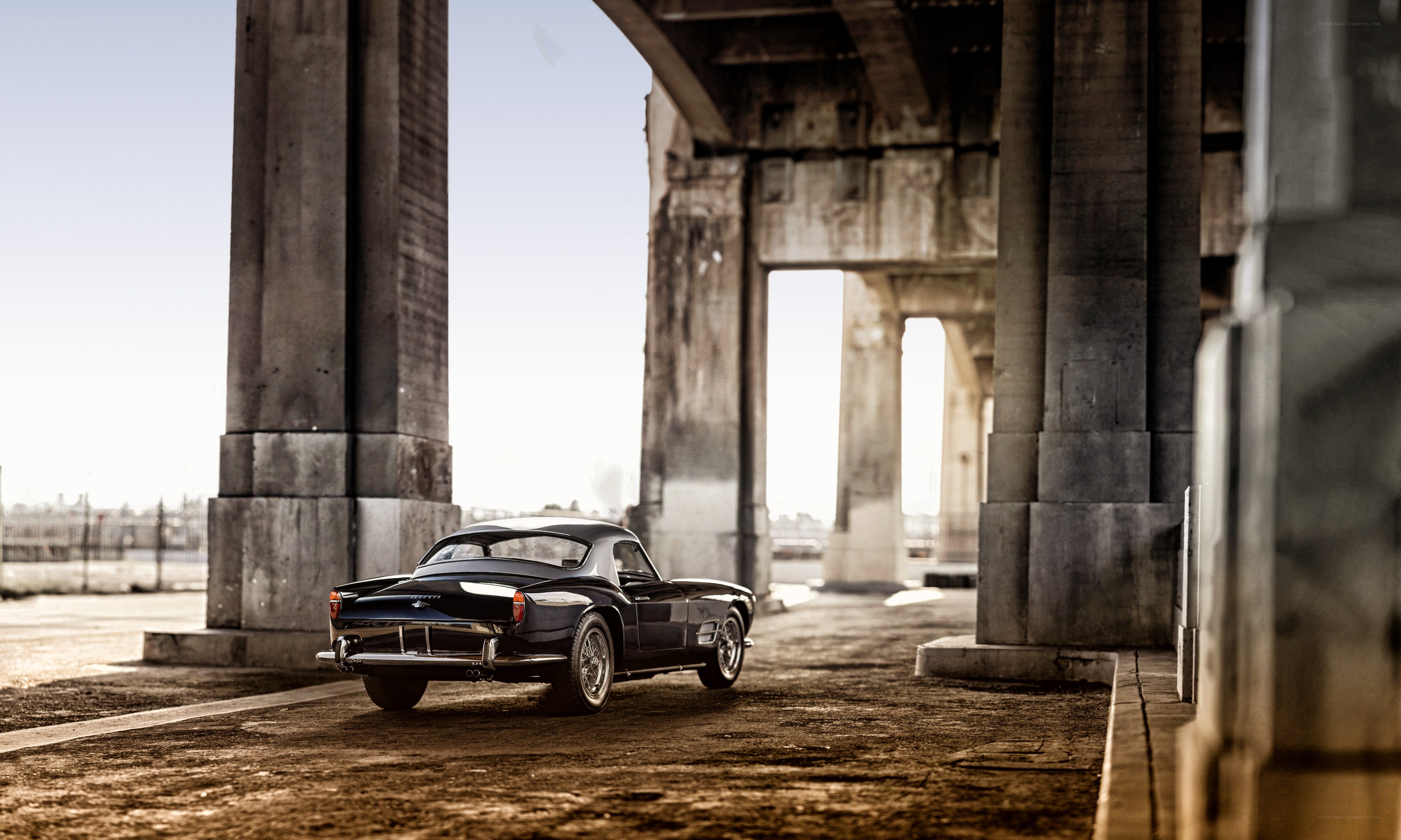 Classic car under a bridge
