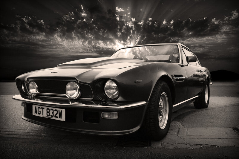 classic car under dramatic sky