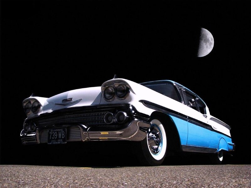 Classic car under moonlight