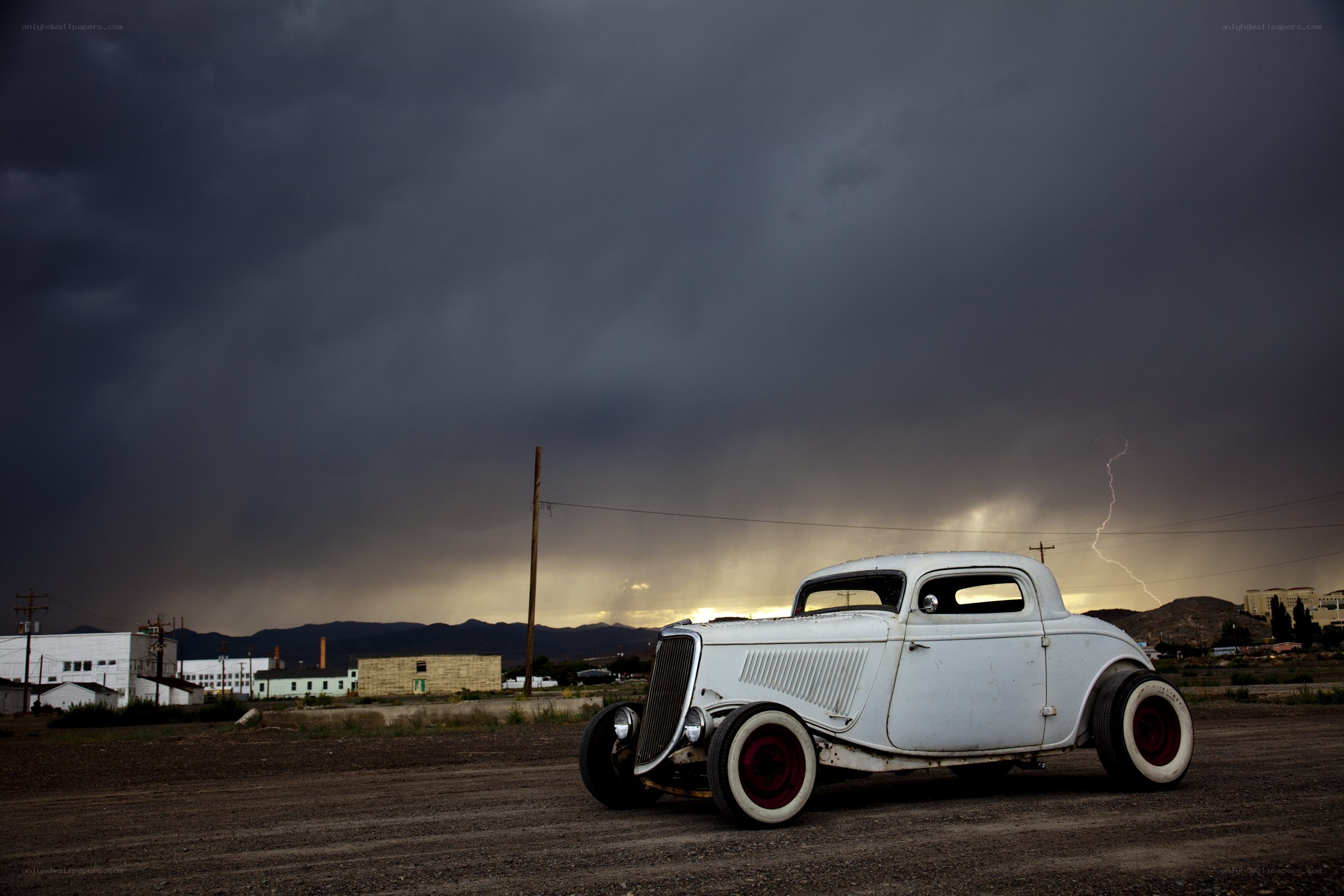 Classic car under stormy sky
