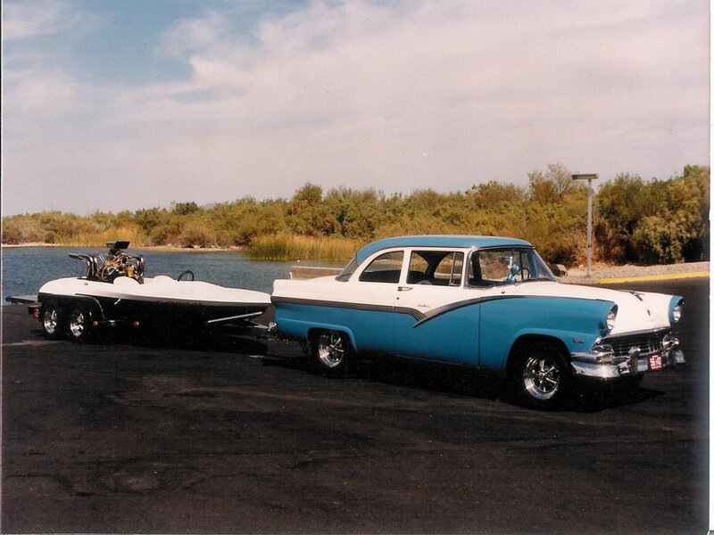 Classic car with boat trailer