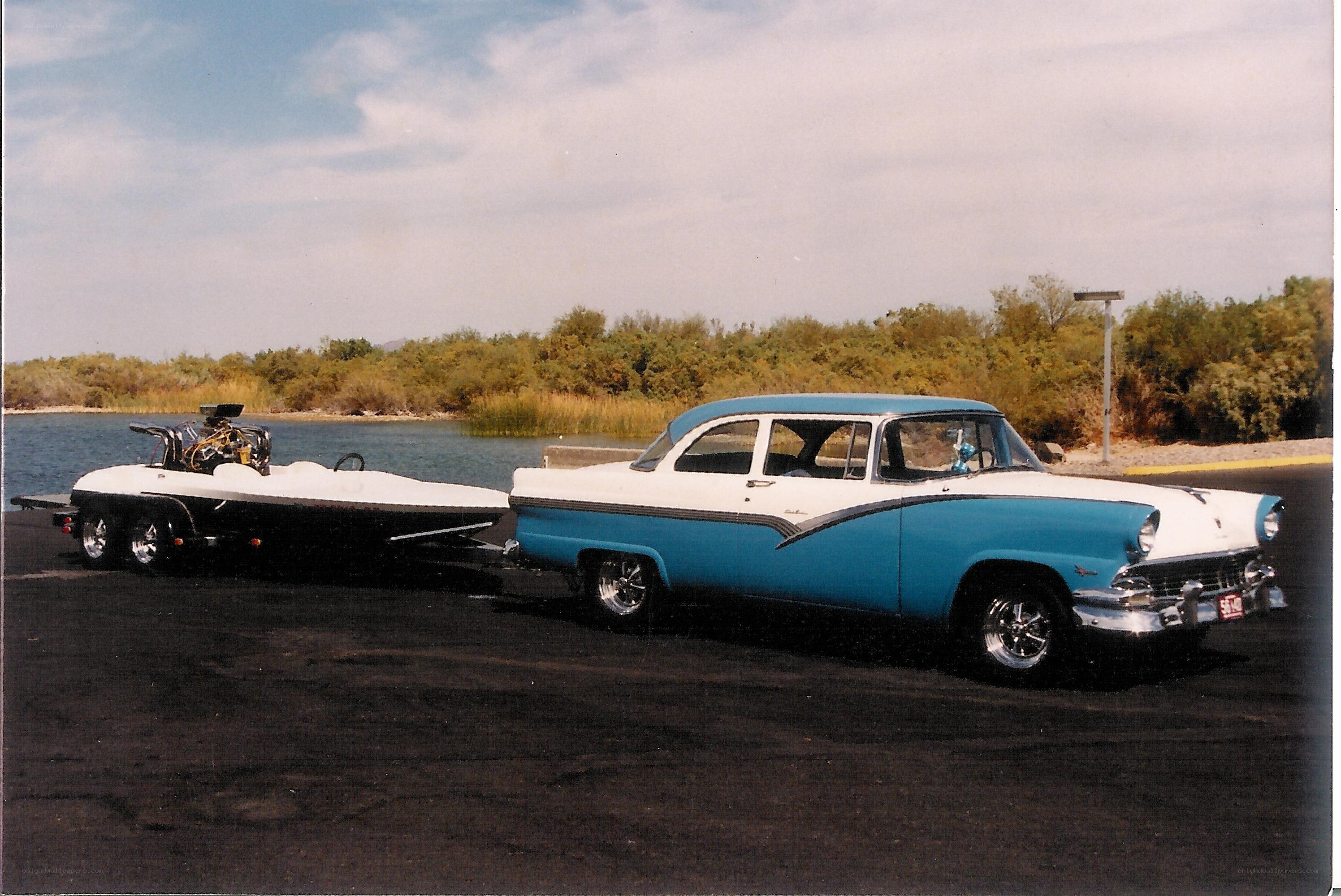 Classic car with boat trailer