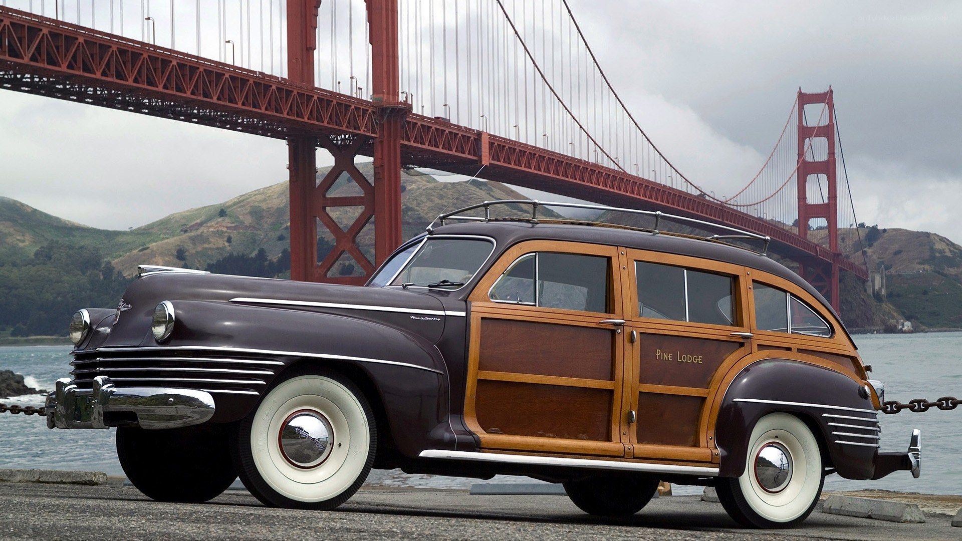 Classic car with Golden Gate Bridge