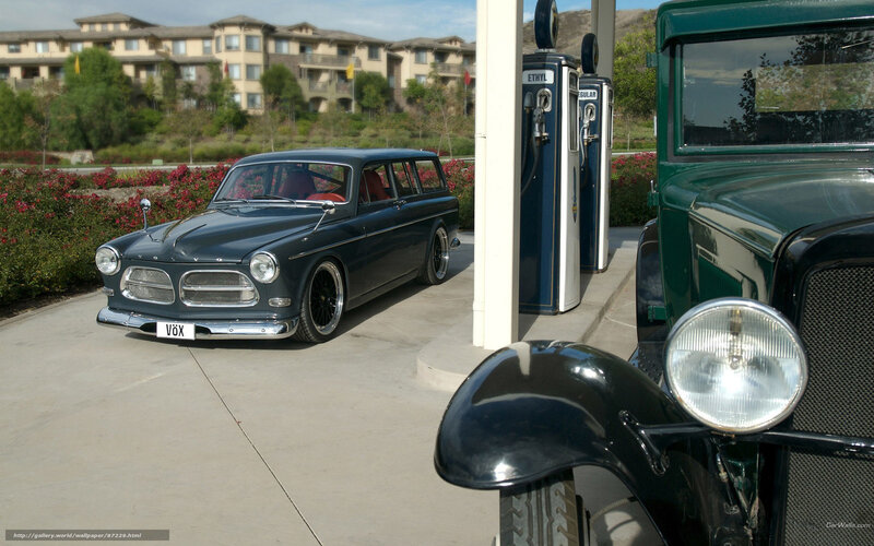 Classic cars at a vintage gas station