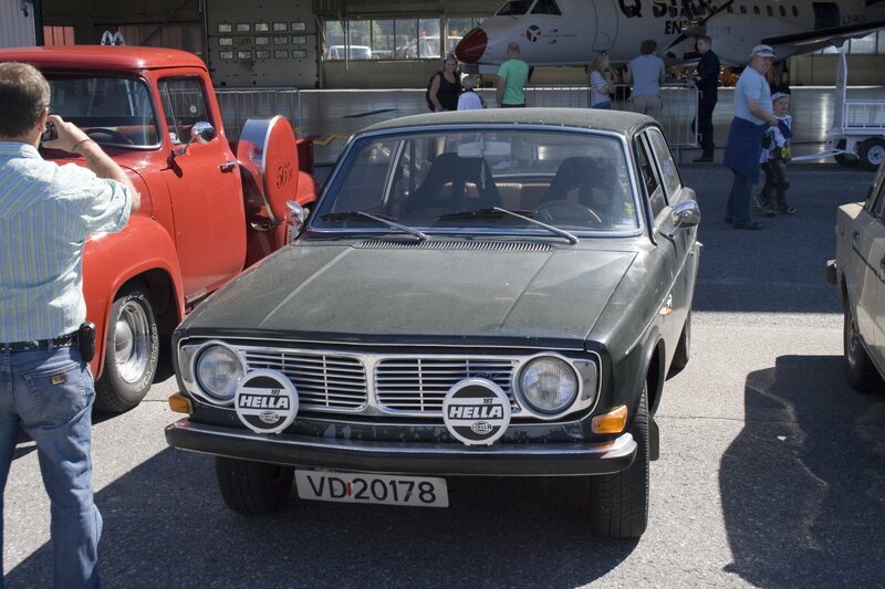 Classic cars at an airfield event