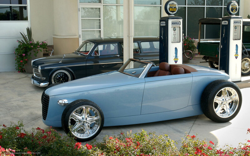 Classic cars at vintage gas station