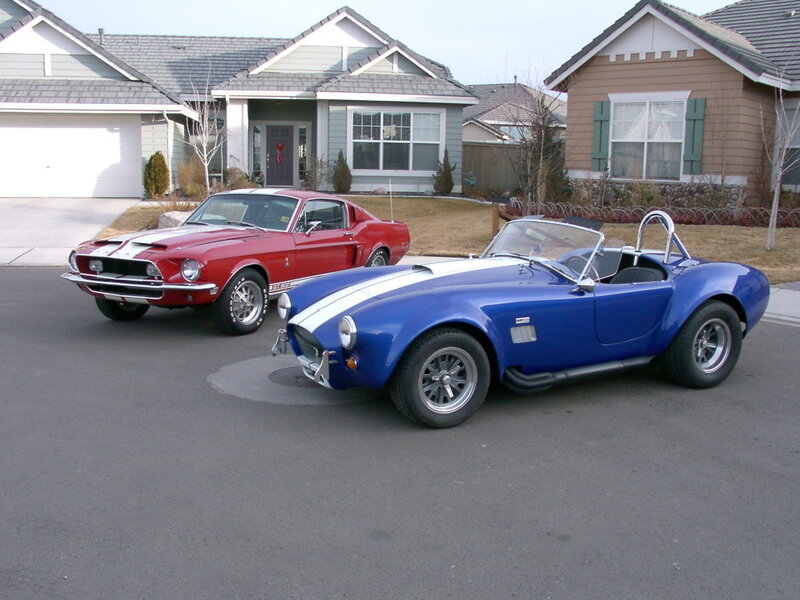 Classic cars in driveway