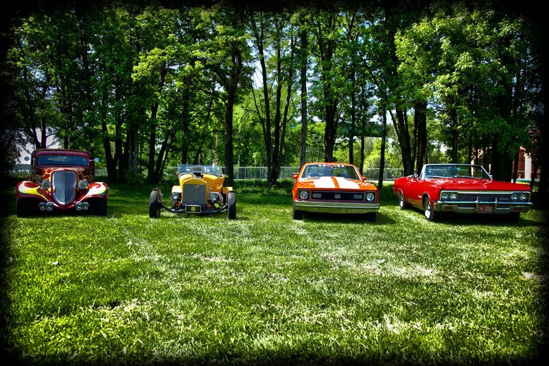 Classic cars on a grassy lawn
