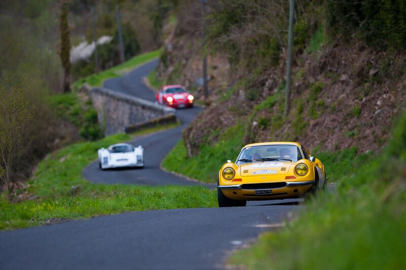 Classic cars on a winding road