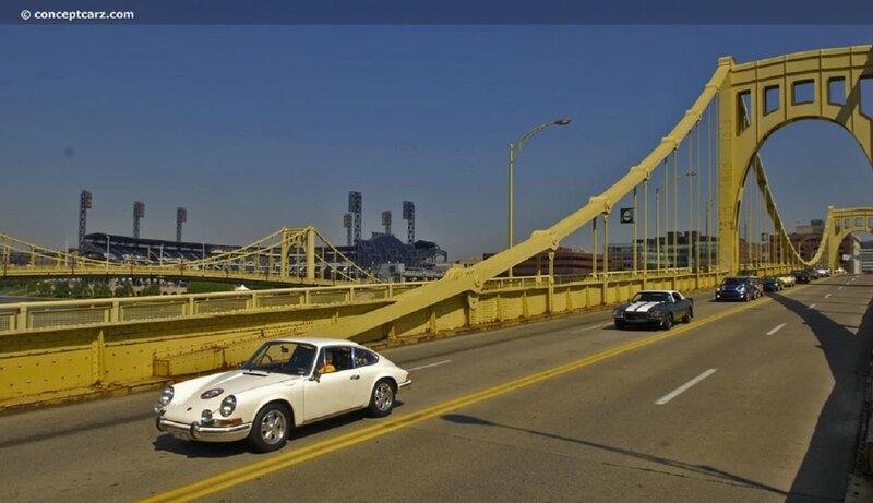 Classic cars on a yellow bridge