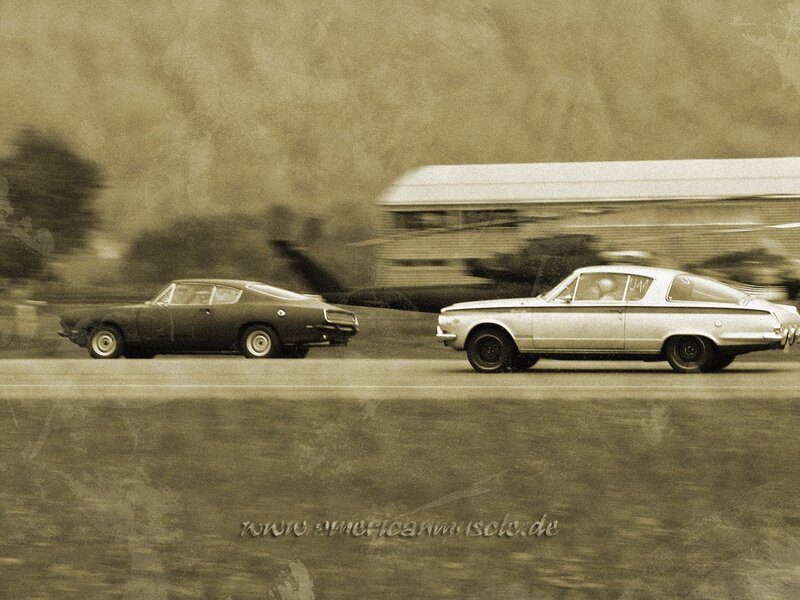 Classic cars racing on track