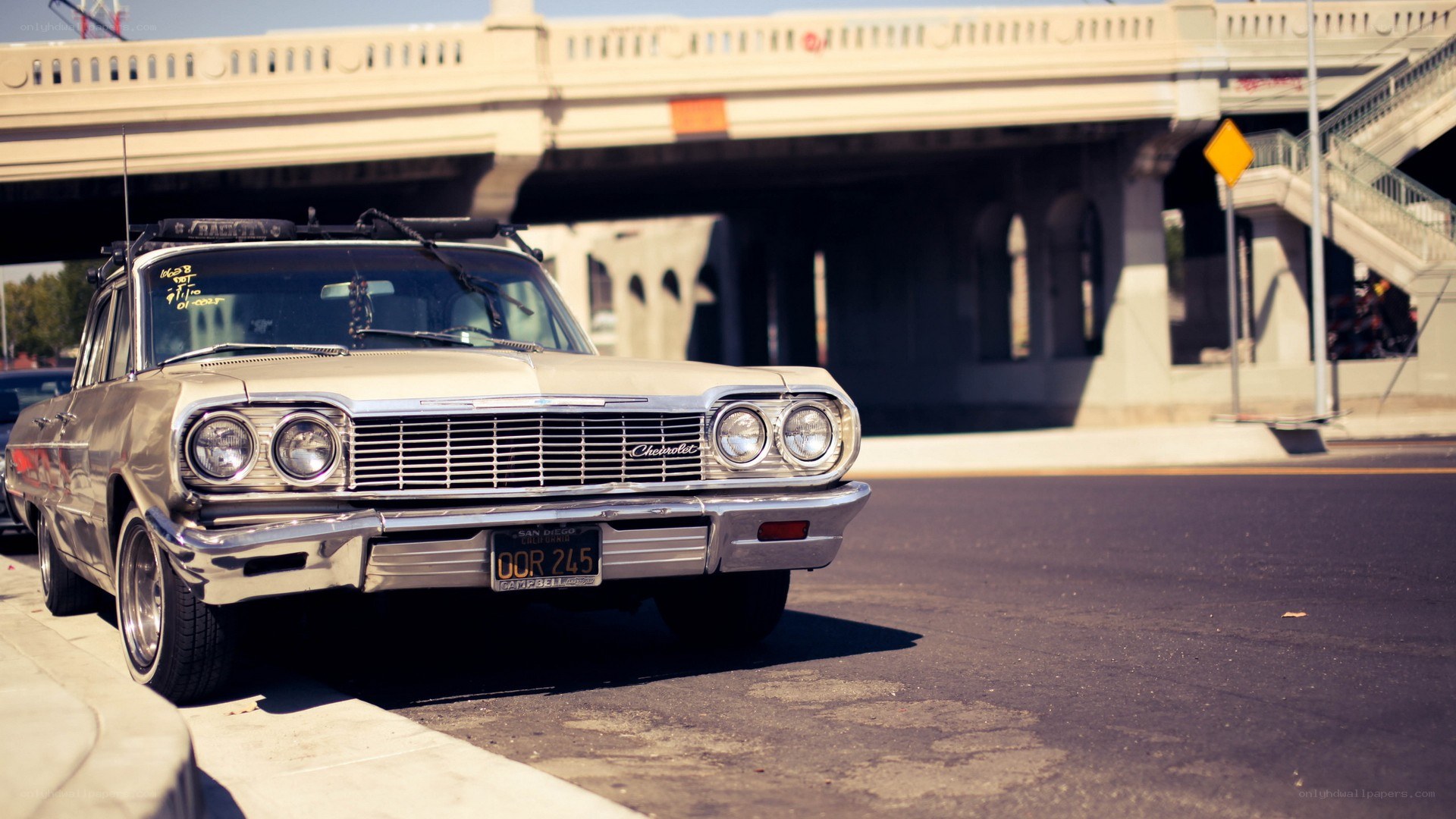 Classic Chevrolet under a bridge