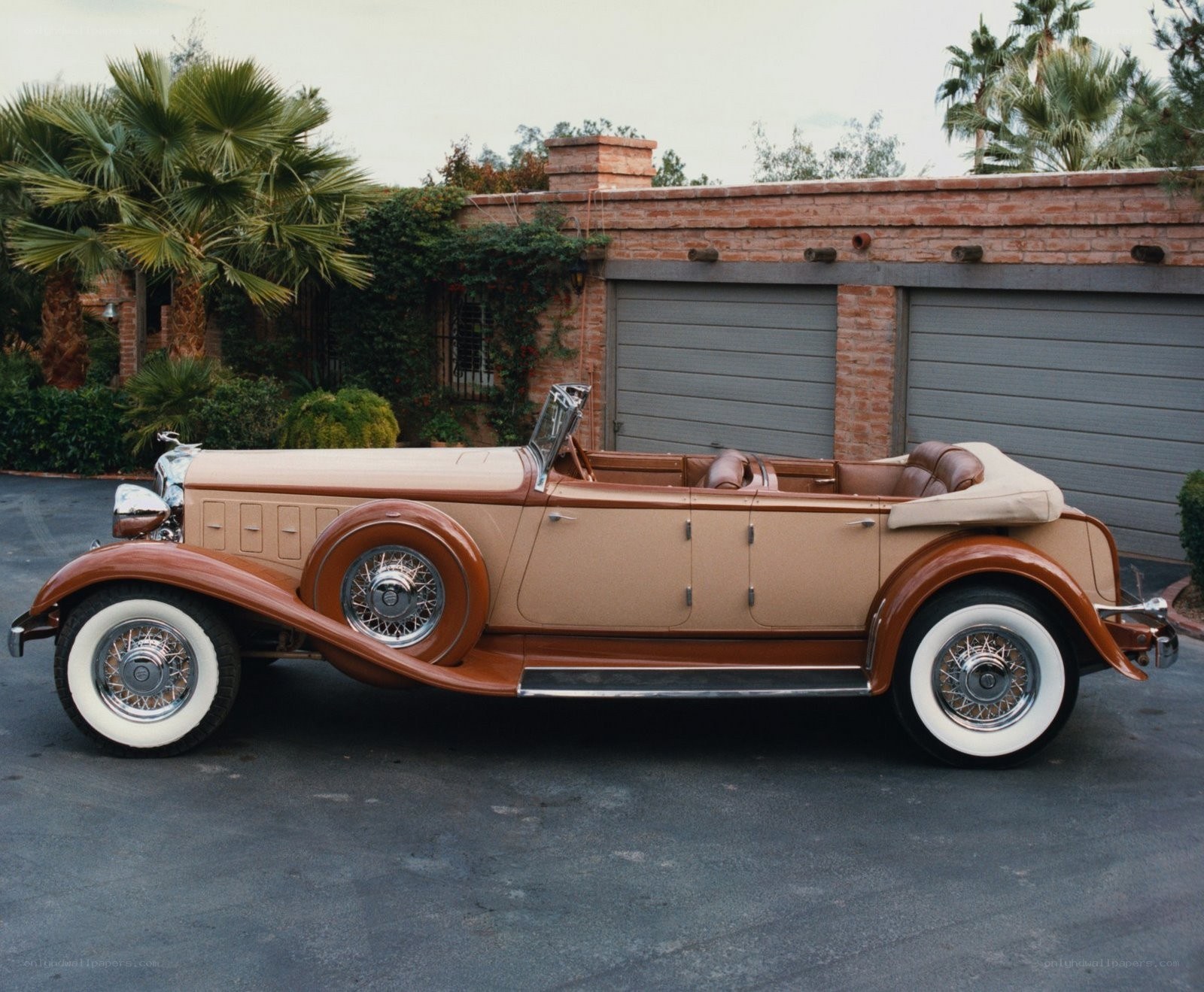 Classic convertible car in driveway