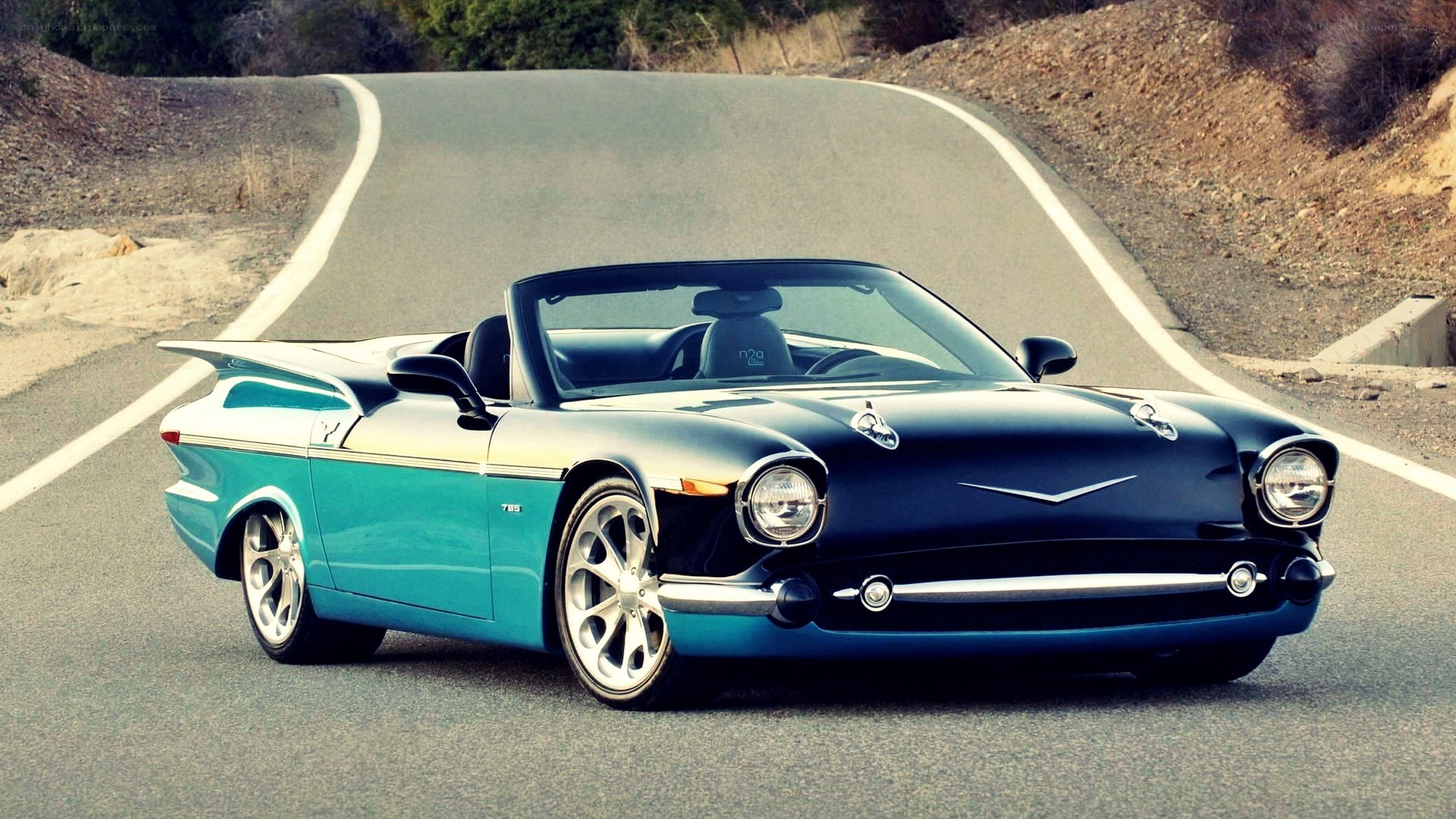 classic convertible on winding road