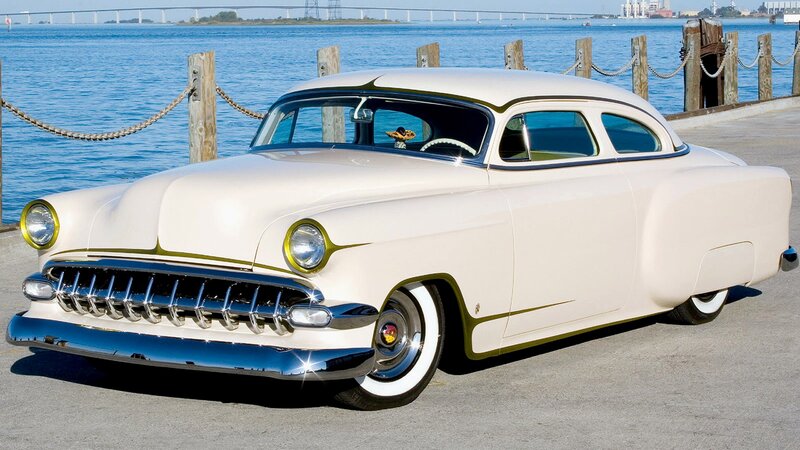 Classic cream car by the water