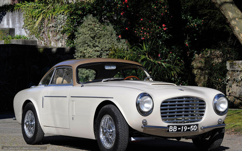 Classic cream car in garden